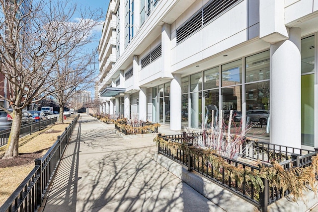 view of community featuring fence