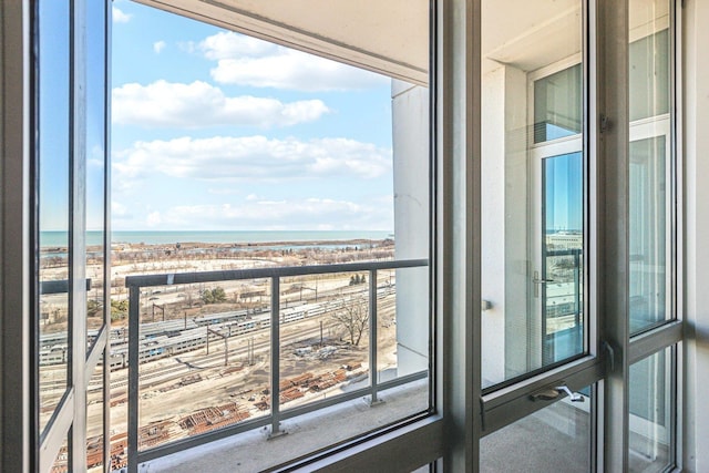 balcony featuring a water view