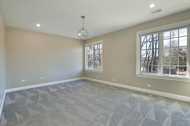 carpeted empty room featuring recessed lighting, baseboards, and visible vents