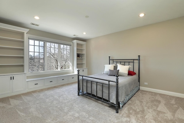 bedroom featuring recessed lighting, visible vents, and light colored carpet