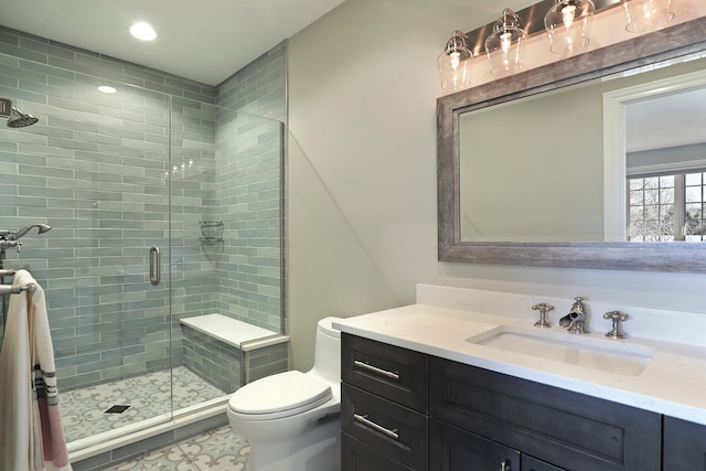 bathroom with recessed lighting, vanity, toilet, and a shower stall