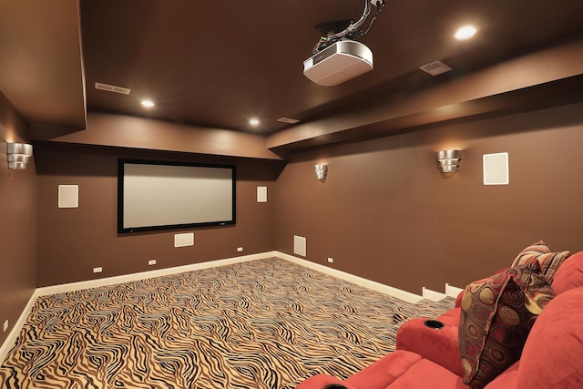 carpeted cinema with visible vents, recessed lighting, and baseboards