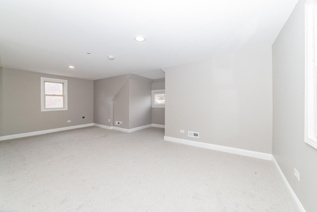 bonus room with light carpet, visible vents, baseboards, and recessed lighting