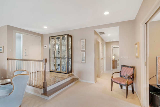 hall with recessed lighting, visible vents, baseboards, and carpet