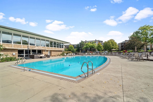 pool with a patio area