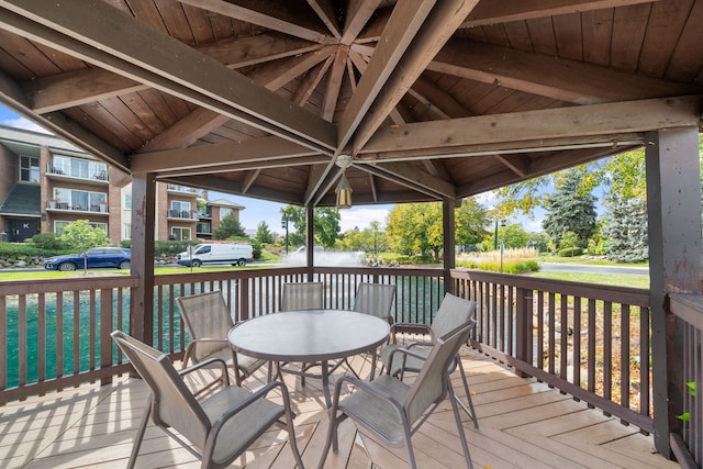 wooden terrace with outdoor dining area