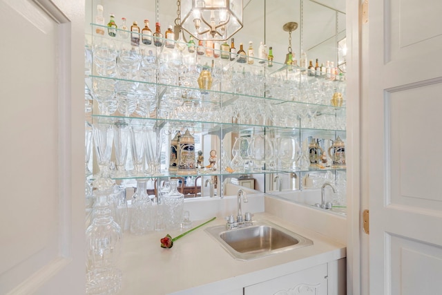 bar with a sink and indoor wet bar