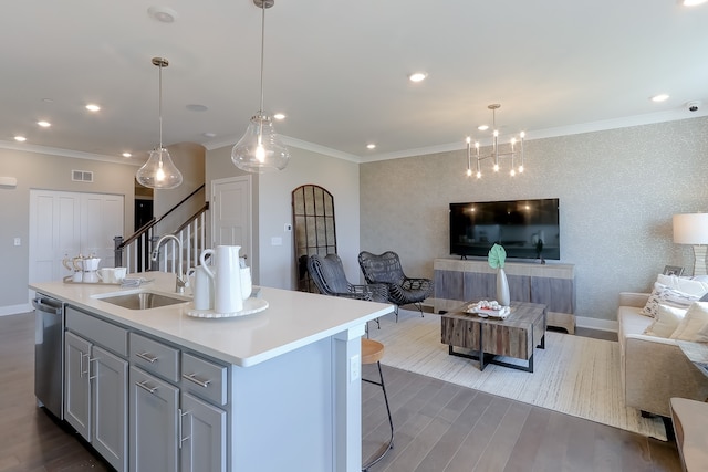 kitchen with dark wood-type flooring, a sink, open floor plan, light countertops, and dishwasher