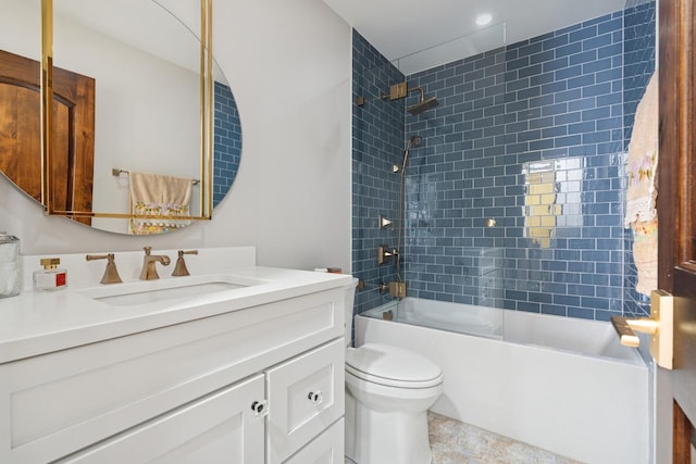 bathroom with shower / bathing tub combination, toilet, and vanity