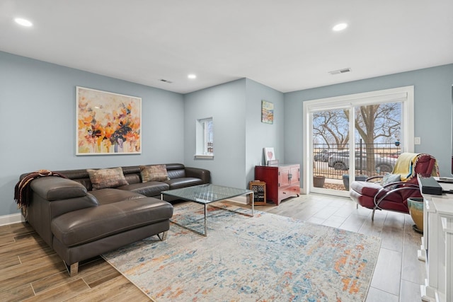 living area featuring recessed lighting, wood finished floors, and visible vents