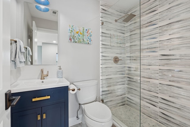 bathroom with visible vents, toilet, vanity, and walk in shower