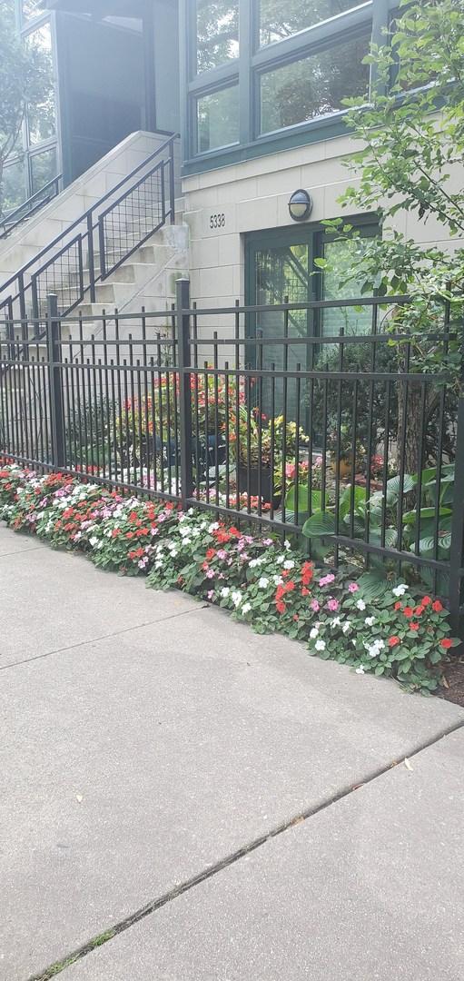 view of gate with a fenced front yard