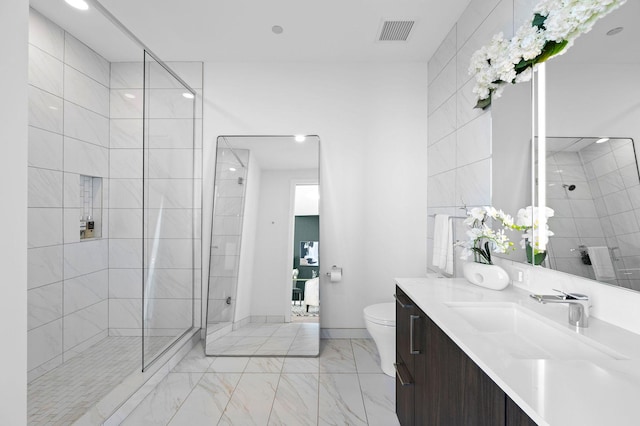 bathroom with marble look tile flooring, a walk in shower, vanity, toilet, and recessed lighting