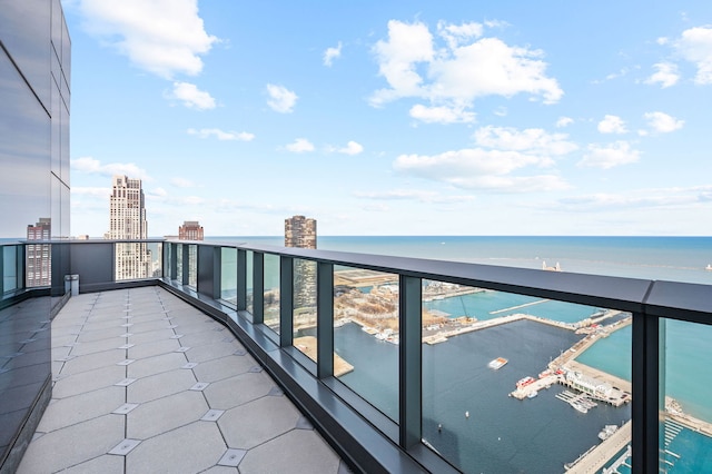 balcony featuring a water view