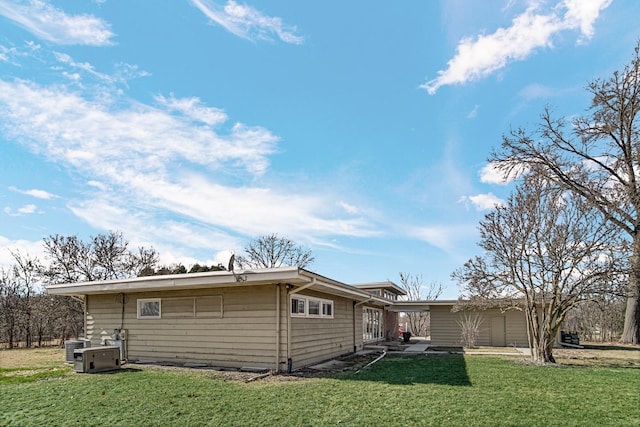 back of house with a yard and a patio area