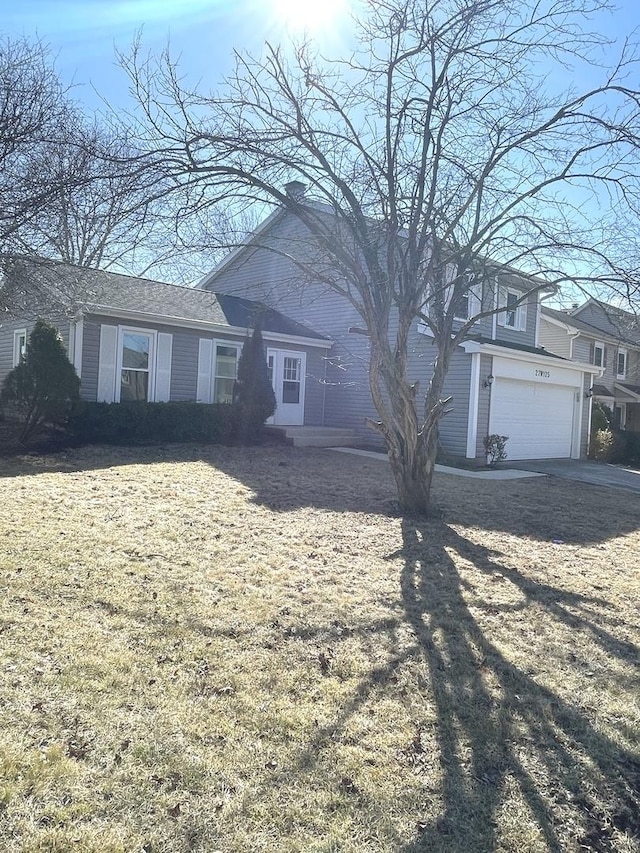 view of front of house featuring an attached garage and driveway