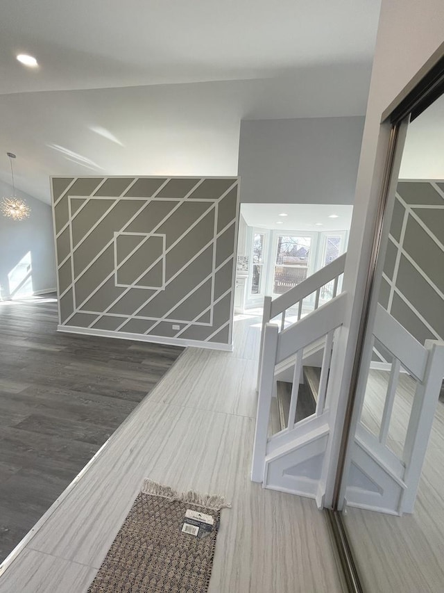 interior space with an inviting chandelier and wood finished floors