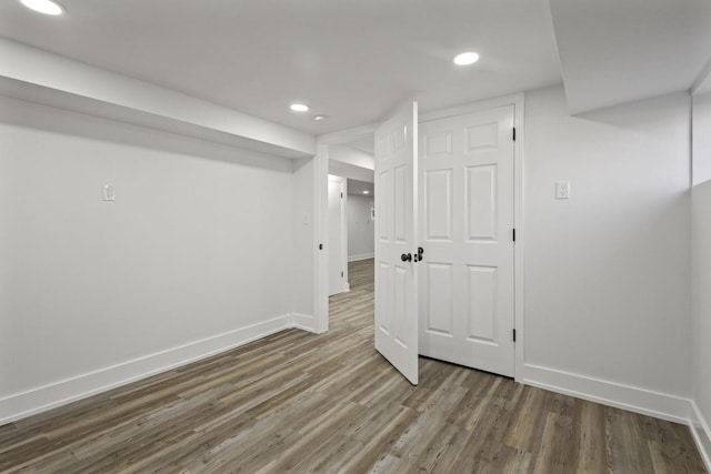 finished below grade area with recessed lighting, wood finished floors, and baseboards