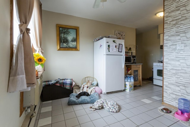 interior space with ceiling fan and light tile patterned flooring