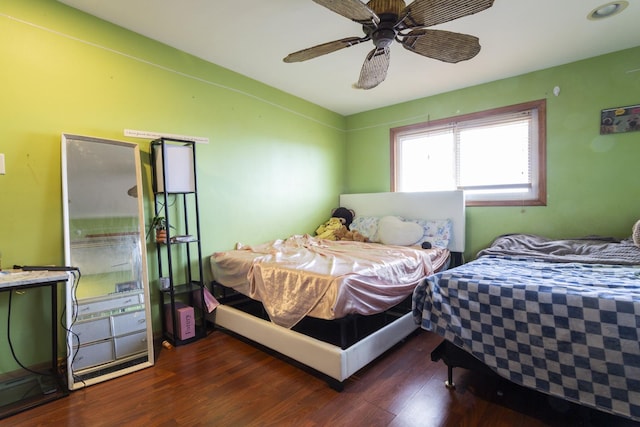 bedroom featuring a ceiling fan and wood finished floors