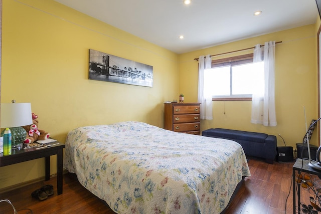 bedroom featuring recessed lighting and wood finished floors