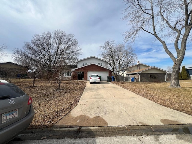 view of front of property featuring concrete driveway and brick siding