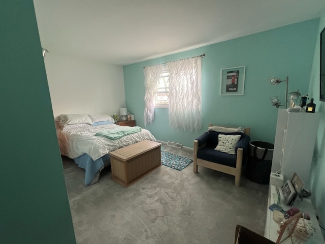 bedroom with carpet floors and visible vents