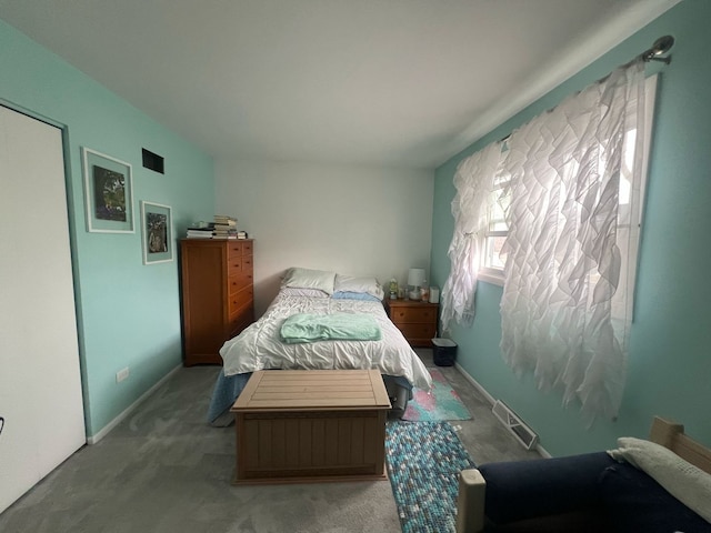 bedroom with baseboards, visible vents, and carpet flooring