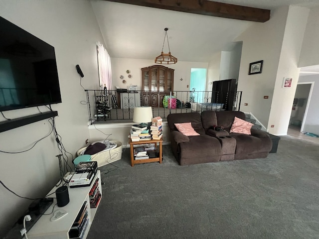 carpeted living room featuring lofted ceiling with beams