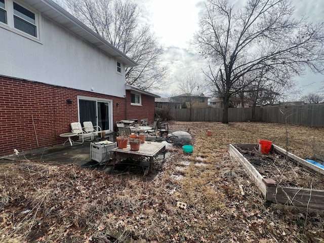 view of yard with a patio area and fence