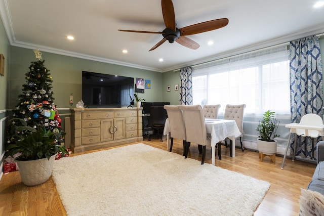 interior space featuring recessed lighting, light wood-type flooring, ornamental molding, and a ceiling fan