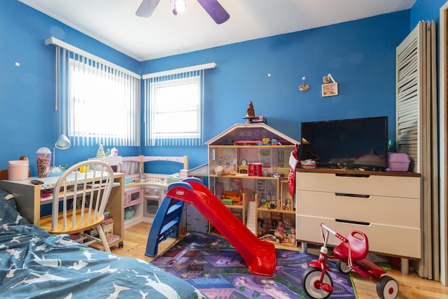 bedroom featuring wood finished floors and ceiling fan