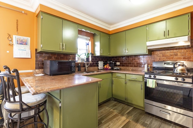 kitchen featuring under cabinet range hood, stainless steel range with gas cooktop, black microwave, and crown molding