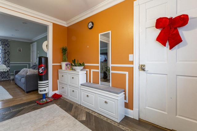 interior space with dark wood finished floors, baseboards, and ornamental molding