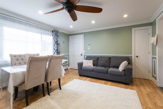 living room with recessed lighting, wood finished floors, and ornamental molding