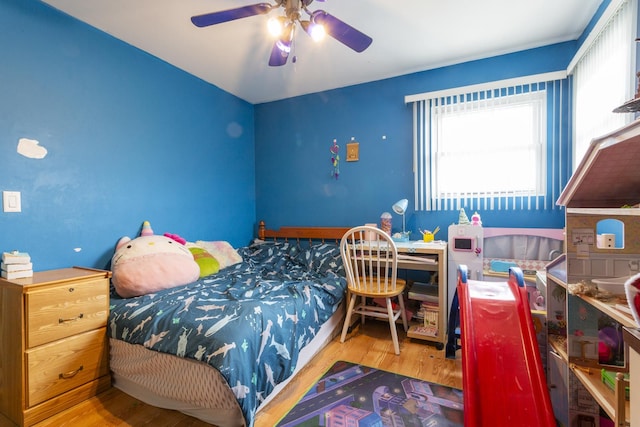 bedroom featuring ceiling fan and wood finished floors