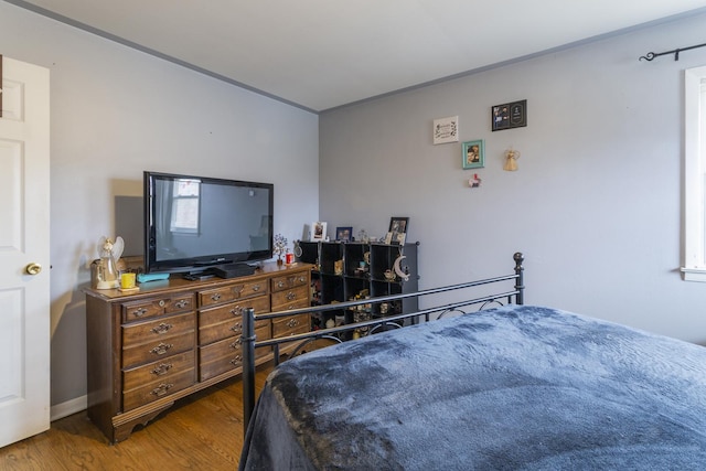 bedroom with wood finished floors