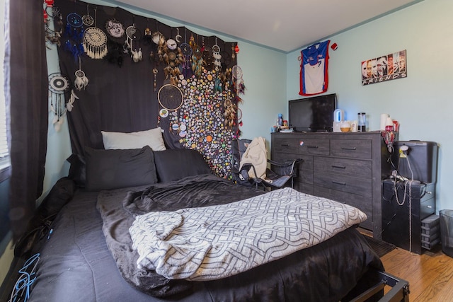 bedroom with wood finished floors