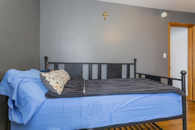 bedroom featuring wood finished floors