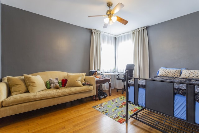 bedroom featuring a ceiling fan and wood finished floors