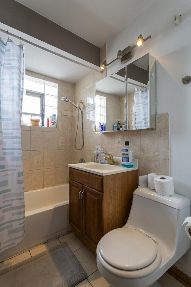 full bathroom with backsplash, toilet, shower / tub combo, tile patterned floors, and tile walls