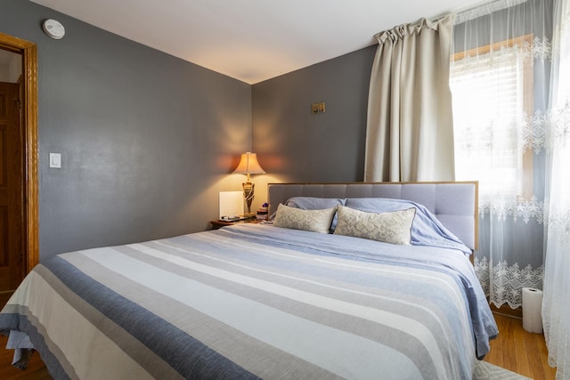 bedroom featuring wood finished floors