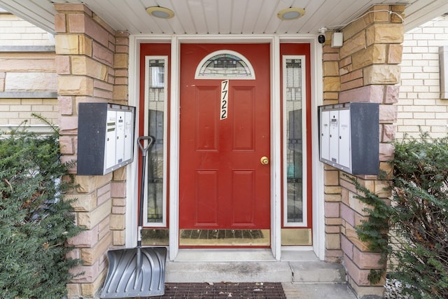 property entrance with brick siding