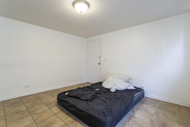 bedroom featuring baseboards