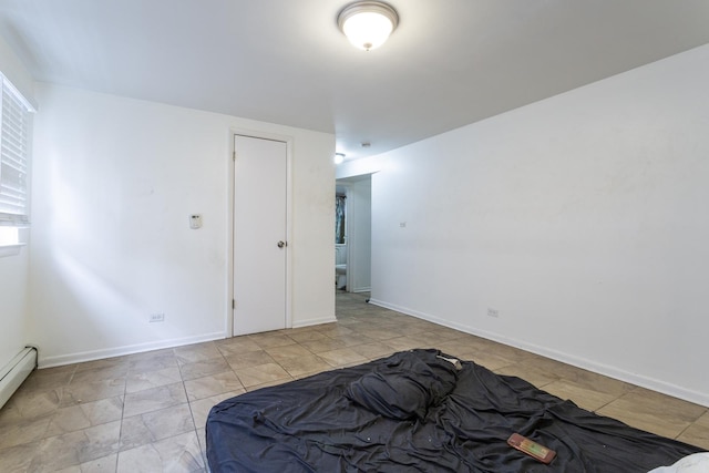 bedroom with baseboards and baseboard heating