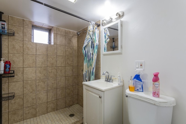 bathroom featuring vanity, a shower stall, and toilet