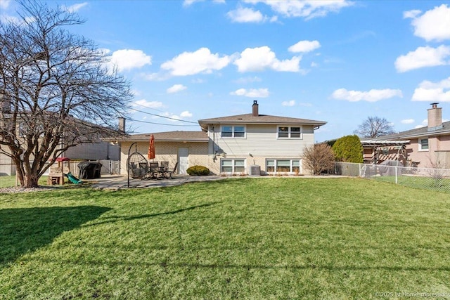 back of property featuring a patio, central AC, fence, a playground, and a yard