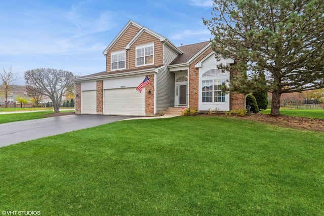 traditional-style home featuring a garage, a front yard, brick siding, and driveway