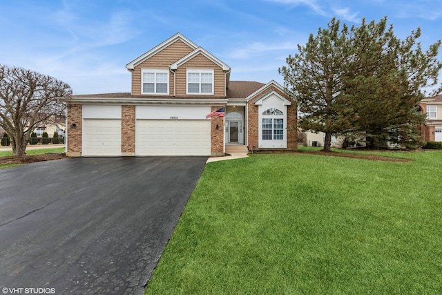 view of front of house featuring a front lawn, brick siding, and driveway