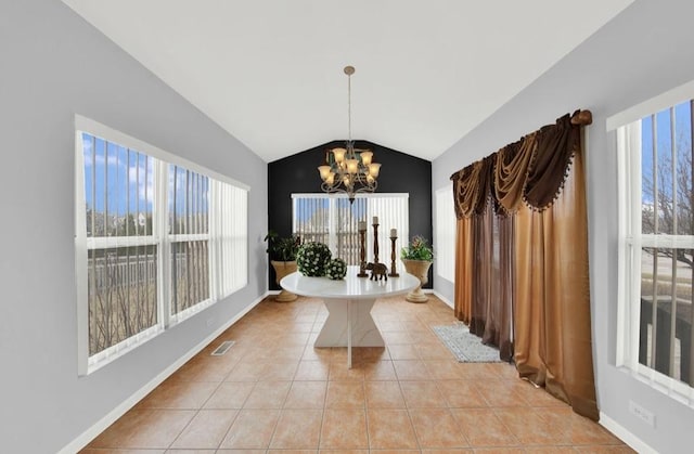 26800 Basswood Cir, Plainfield, IL 60585 - interior space with baseboards, visible vents, lofted ceiling, light tile patterned flooring, and a notable chandelier